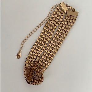 Also gold tone mans bracelet